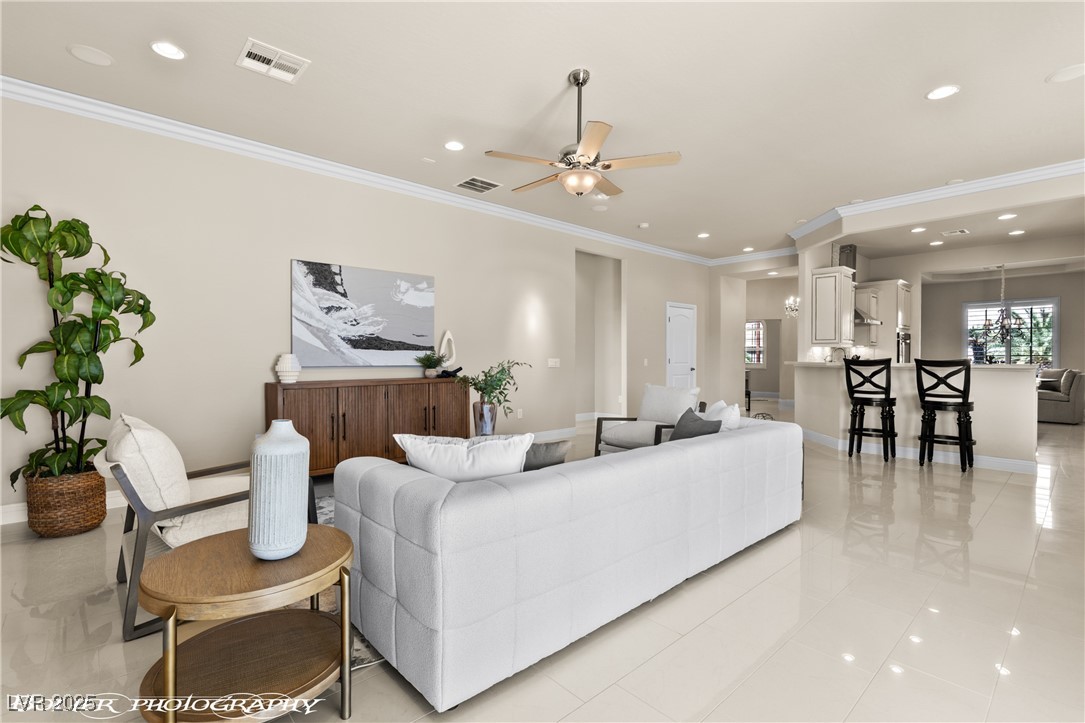 1348 Basin View Mesquite, NV 89034 - Photo 5 of 70 Living area with crown molding, recessed lighting, light tile patterned floors, and ceiling fan