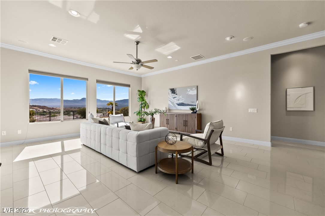 1348 Basin View Mesquite, NV 89034 - Photo 6 of 70 Living area with a mountain view, ornamental molding, light tile patterned floors, ceiling fan, and recessed lighting