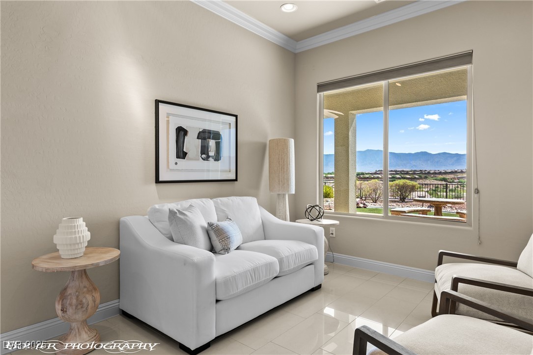 1348 Basin View Mesquite, NV 89034 - Photo 7 of 70 Living room featuring a mountain view, ornamental molding, and light tile patterned floors