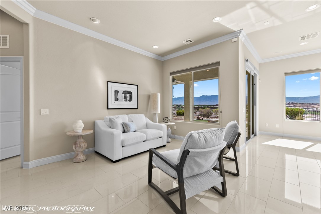 1348 Basin View Mesquite, NV 89034 - Photo 10 of 70 Living area featuring ornamental molding, a mountain view, light tile patterned floors, and recessed lighting