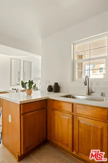 a kitchen with sink and window