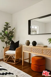 a living room with furniture and a rug