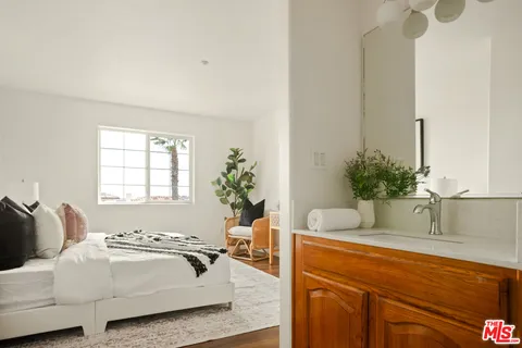 a white toilet sitting next to a bath tub and a shower curtain