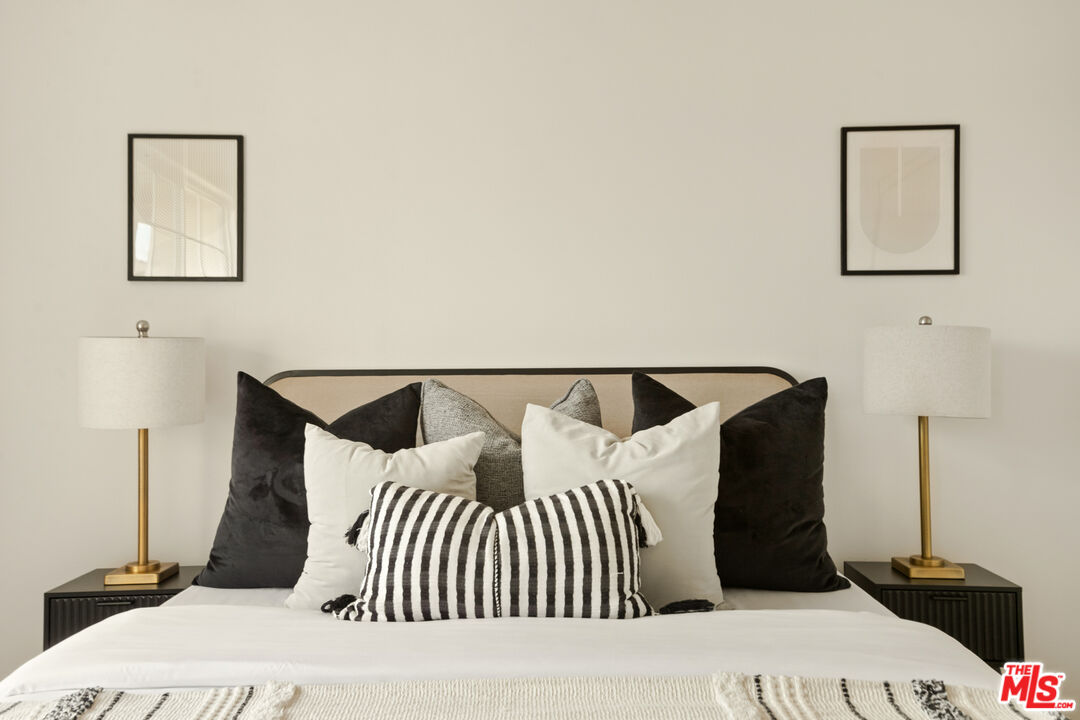 3711 Baldwin Street, Unit 1306 Los Angeles, CA 90031 - Photo 23 of 35 a bedroom with a bed and a night stand
