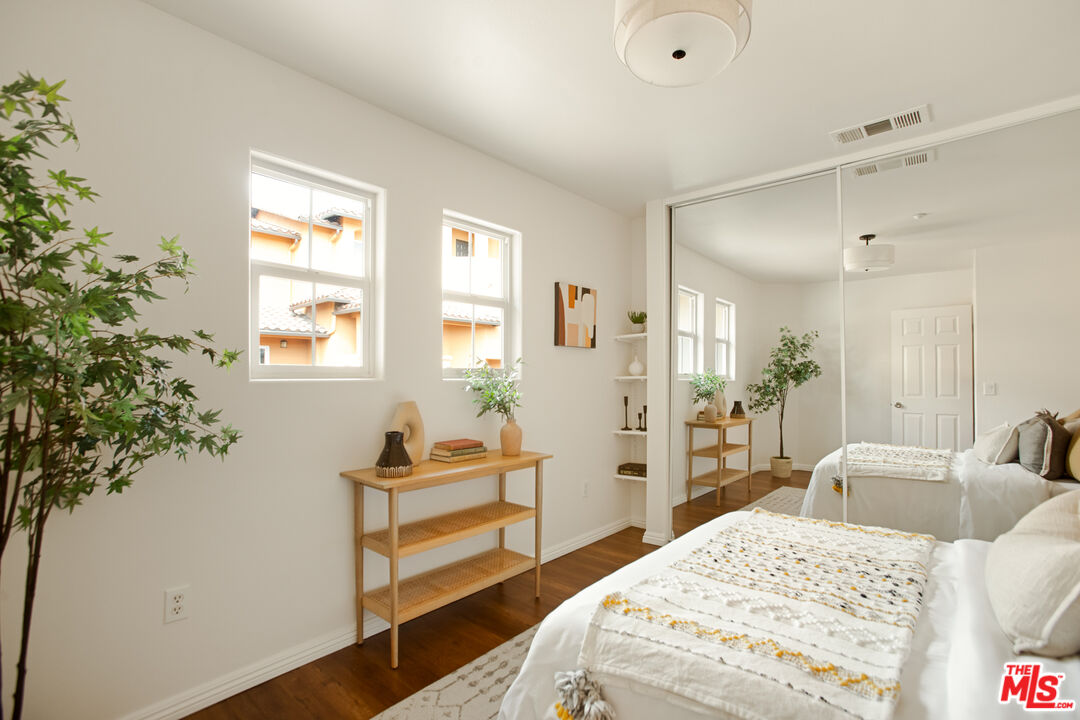 3711 Baldwin Street, Unit 1306 Los Angeles, CA 90031 - Photo 25 of 35 a bedroom with a bed and a potted plant