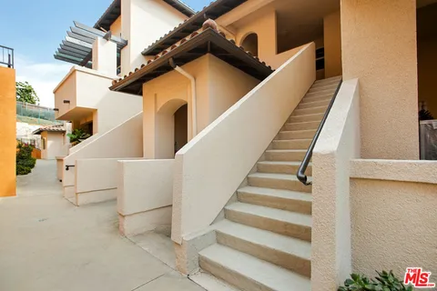 a view of a room with furniture and front door