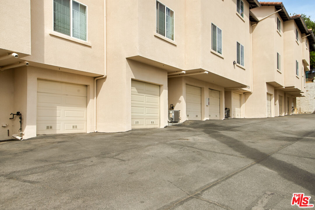 3711 Baldwin Street, Unit 1306 Los Angeles, CA 90031 - Photo 30 of 35 a view of a white building with many windows