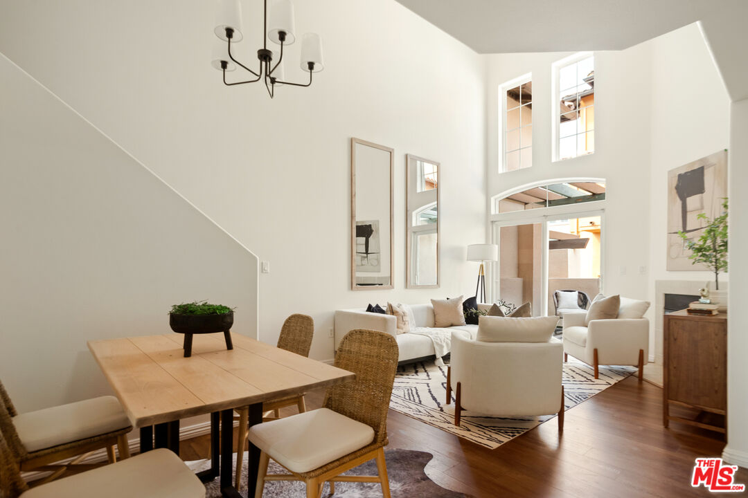 3711 Baldwin Street, Unit 1306 Los Angeles, CA 90031 - Photo 3 of 35 a view of a dining room with furniture window and wooden floor