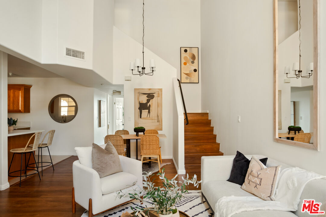 3711 Baldwin Street, Unit 1306 Los Angeles, CA 90031 - Photo 6 of 35 a living room with furniture and a wooden floor