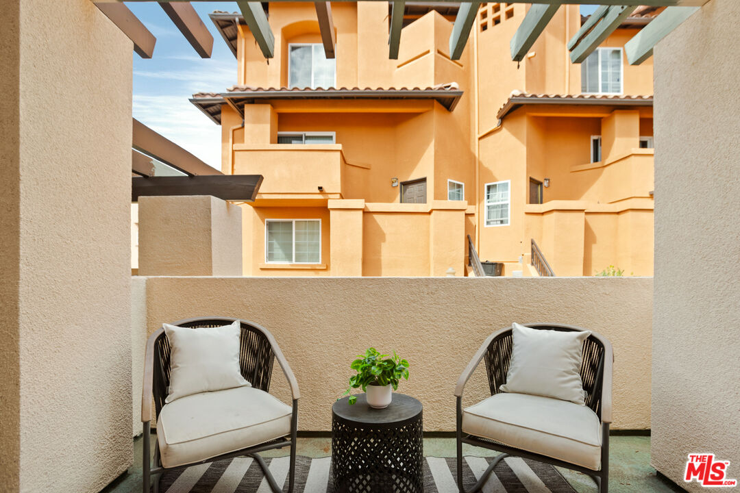 3711 Baldwin Street, Unit 1306 Los Angeles, CA 90031 - Photo 7 of 35 a view of a chair and table in the balcony