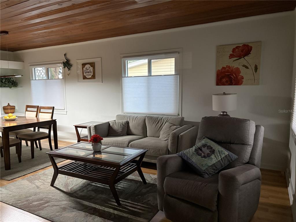 421 Riviera Street Venice, FL 34285 - Photo 8 of 30 a living room with furniture and a wooden floor