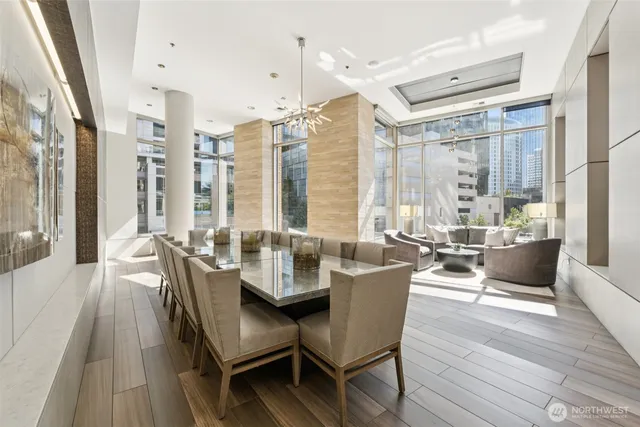 a view of a dining room with furniture window and wooden floor