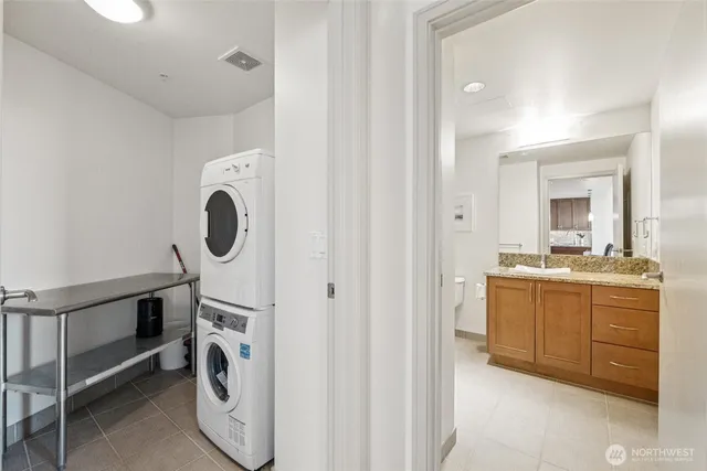 a bathroom with a sink and washing machine