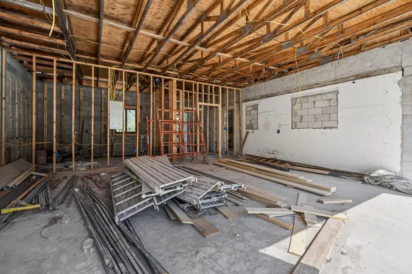 a view of a room with wooden floor