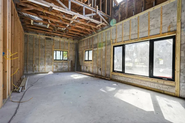 a view of empty room with windows