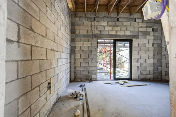 a view of an empty room with a fireplace