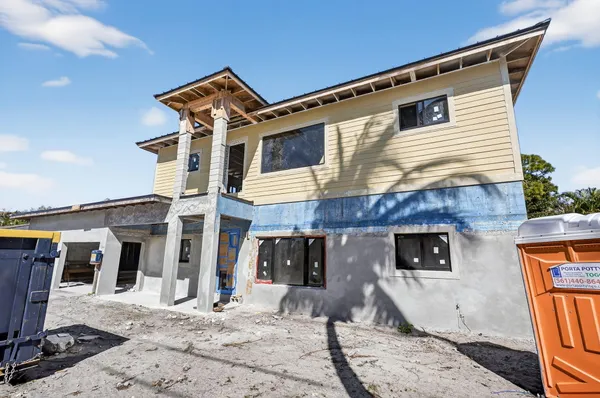 a front view of a house with parking space