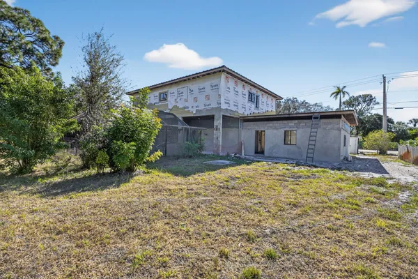 a house view with a backyard space