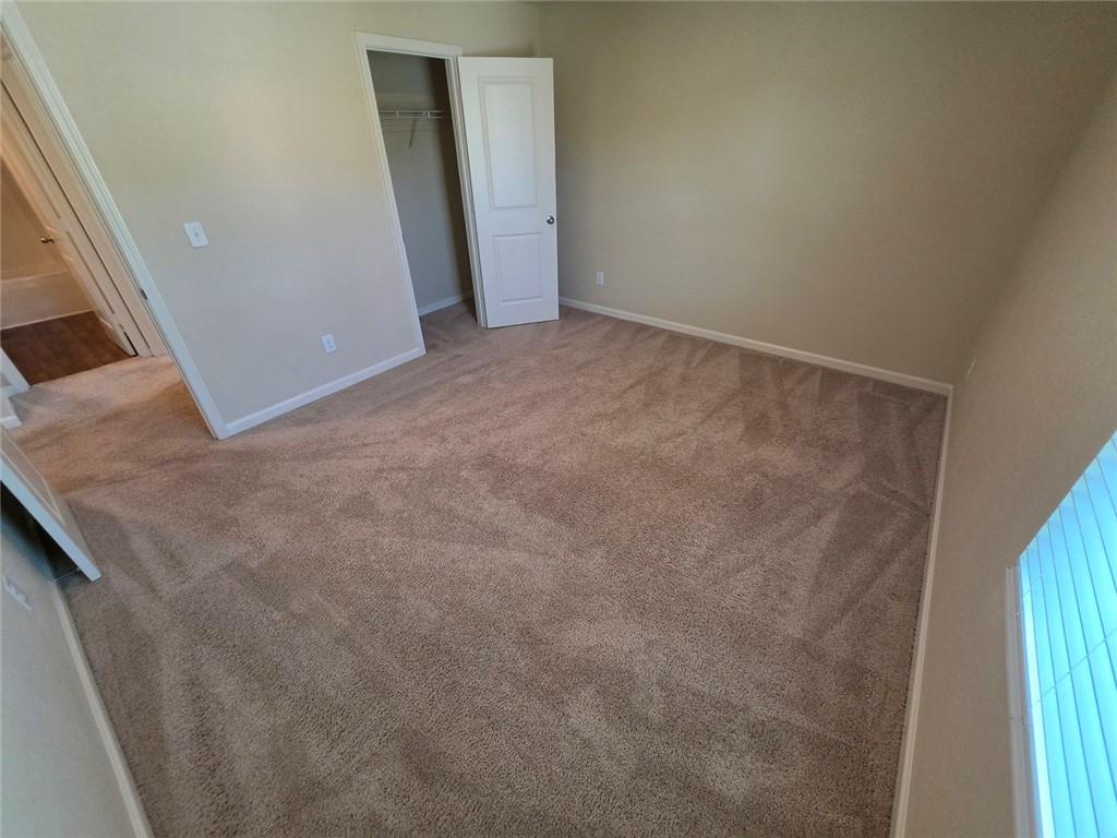 899 Independence Avenue Pendergrass, GA 30567 - Photo 14 of 16 a view of an empty room and a window