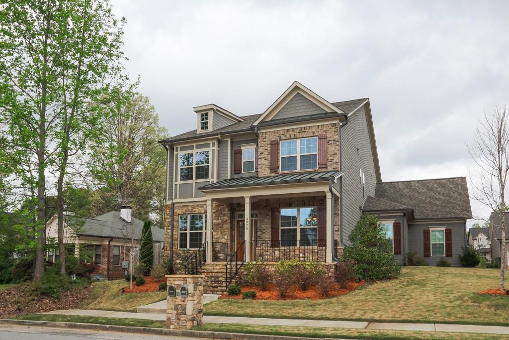 Beautiful craftsman style brick and shake shingle exterior with large covered front porch!