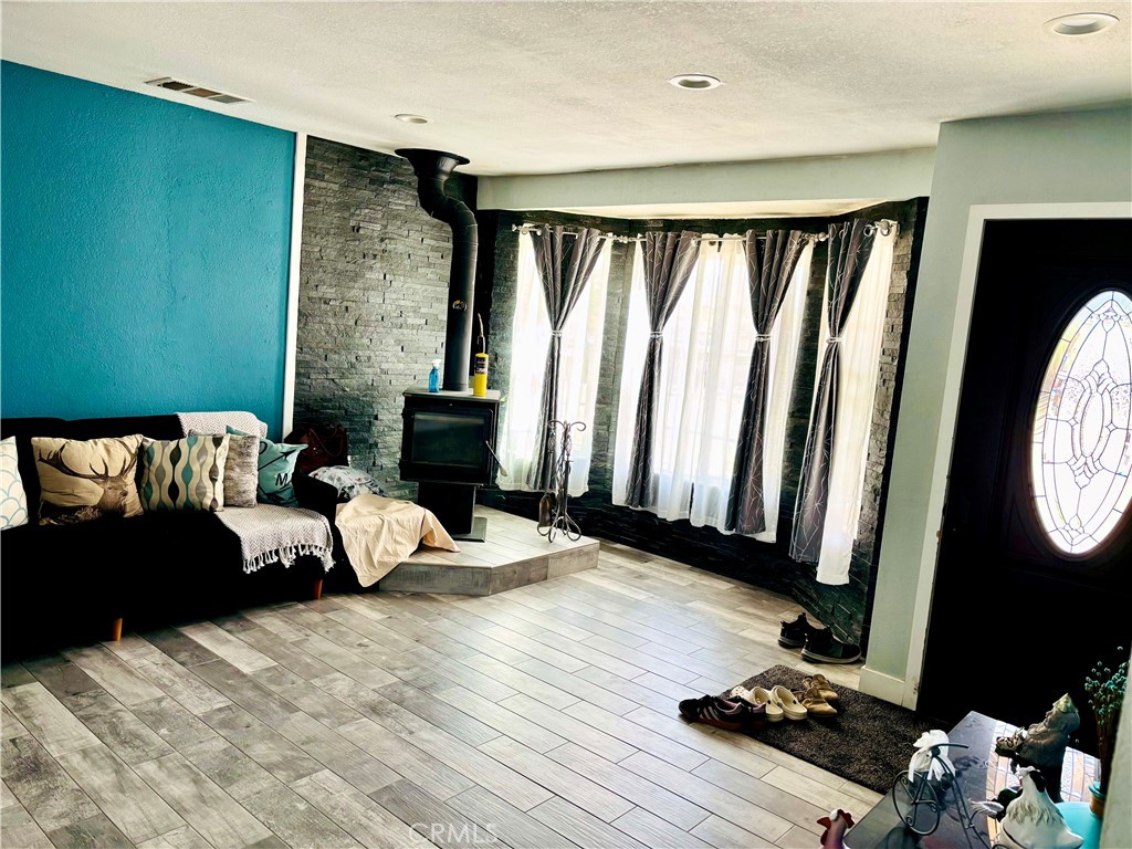 5808 Snow Line Drive Phelan, CA 92371 - Photo 12 of 15 a living room with furniture and a window
