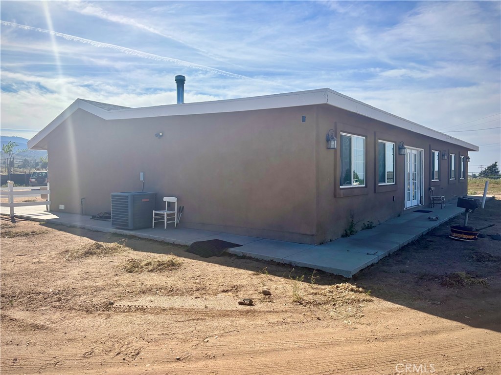 5808 Snow Line Drive Phelan, CA 92371 - Photo 4 of 15 a view of a house with a yard