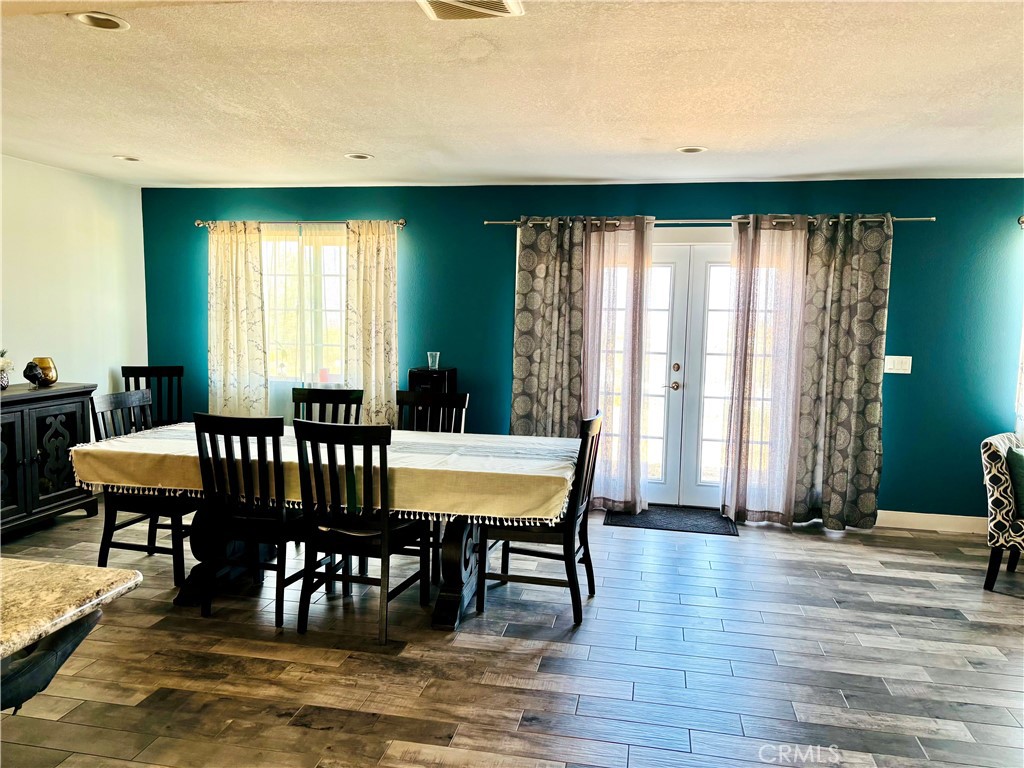 5808 Snow Line Drive Phelan, CA 92371 - Photo 10 of 15 a view of a dining room with furniture and window