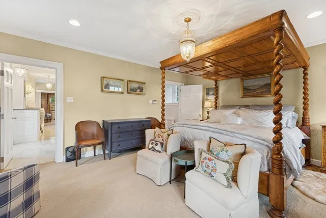 a living room with furniture and a chair