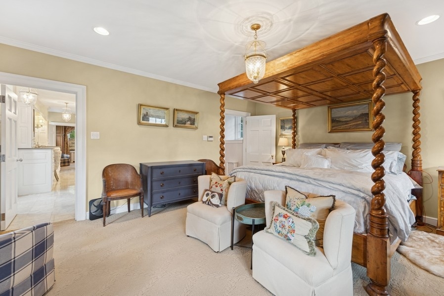 6191 South County Line Road Burr Ridge, IL 60527 - Photo 18 of 38 a living room with furniture and a chair
