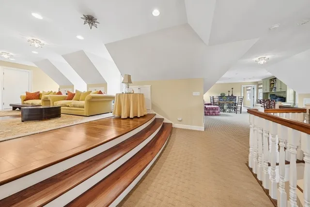 a view of living room with furniture and a rug