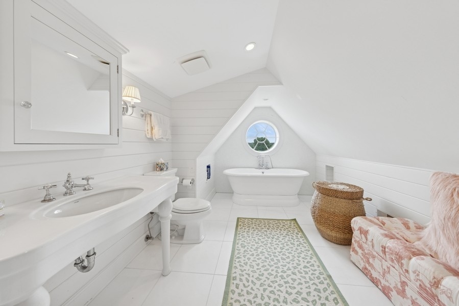6191 South County Line Road Burr Ridge, IL 60527 - Photo 24 of 38 a bathroom with a sink toilet and a mirror
