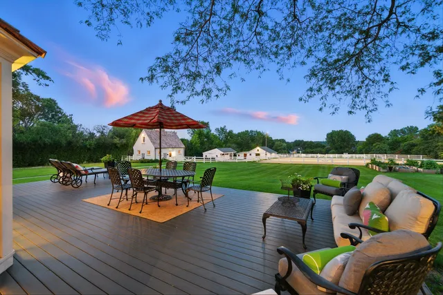 an outdoor space with furniture and garden view