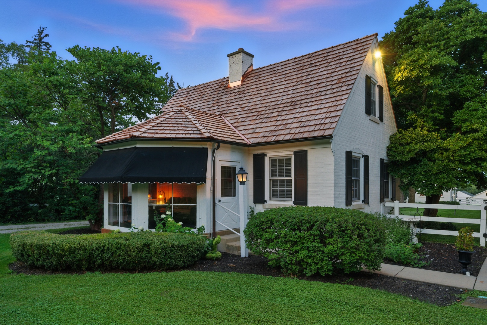 6191 South County Line Road Burr Ridge, IL 60527 - Photo 7 of 38 a front view of a house with a yard