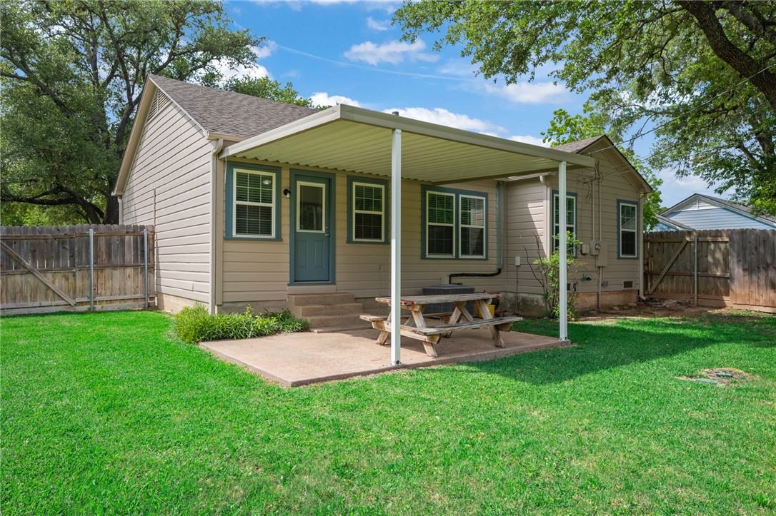715 Inwood Drive Bryan, TX 77802 - Photo 9 of 34 a view of a house with a yard and sitting area