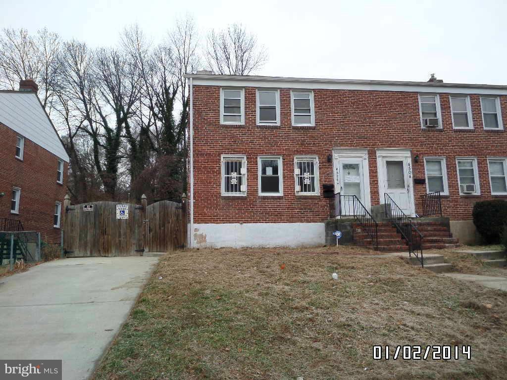 4506 Fairfax Road Baltimore, MD 21216 - Photo 1 of 28 a front view of house with yard