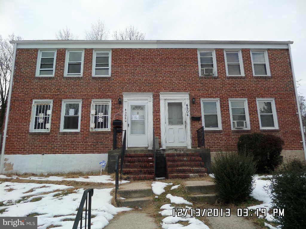 4506 Fairfax Road Baltimore, MD 21216 - Photo 2 of 28 a front view of a house with a yard