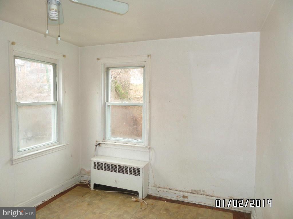 4506 Fairfax Road Baltimore, MD 21216 - Photo 15 of 28 a view of an empty room with a window