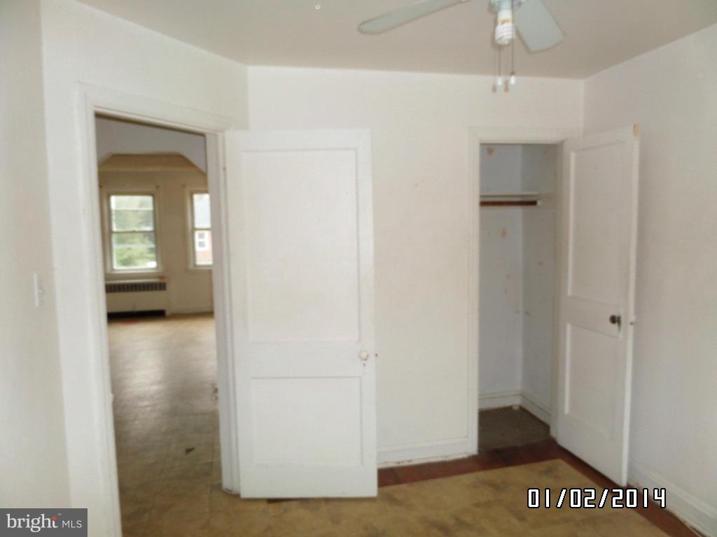 4506 Fairfax Road Baltimore, MD 21216 - Photo 16 of 28 a view of a hallway with a glass door