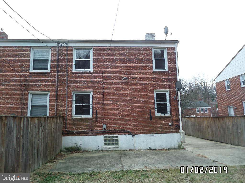 4506 Fairfax Road Baltimore, MD 21216 - Photo 28 of 28 a view of a brick house with a yard