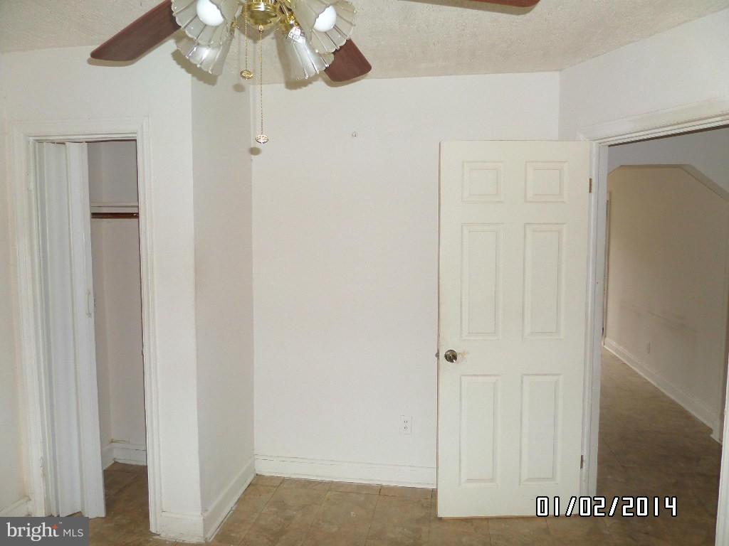 4506 Fairfax Road Baltimore, MD 21216 - Photo 7 of 28 a view of a hallway with a white walls