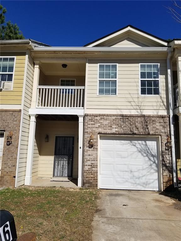 2996 Jonesboro Road Southeast, Unit B Atlanta, GA 30354 - Photo 1 of 1 a front view of a house with garage