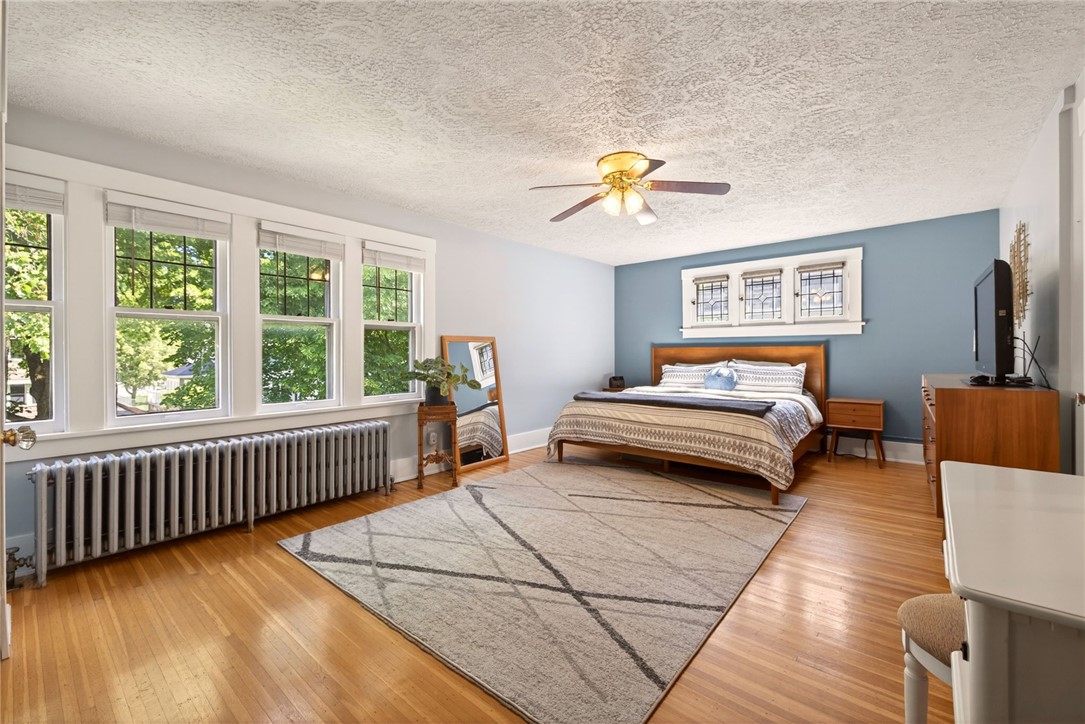29 Elmcroft Road Rochester, NY 14609 - Photo 22 of 42 Spacious primary bedroom is filled with light & do