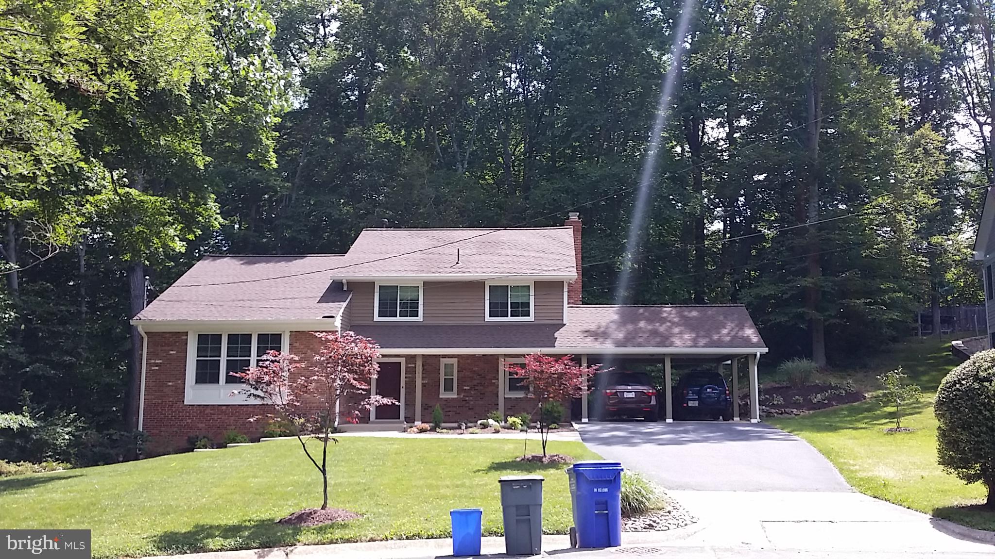 8543 Howell Road Bethesda, MD 20817 - Photo 1 of 24 front view of a house with a patio