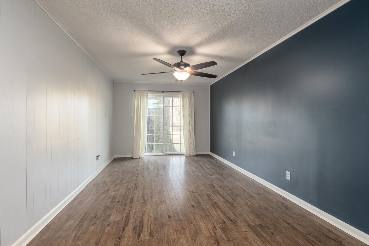401 Green Acres Road Memphis, TN 38117 - Photo 16 of 34 wooden floor in an empty room with a window