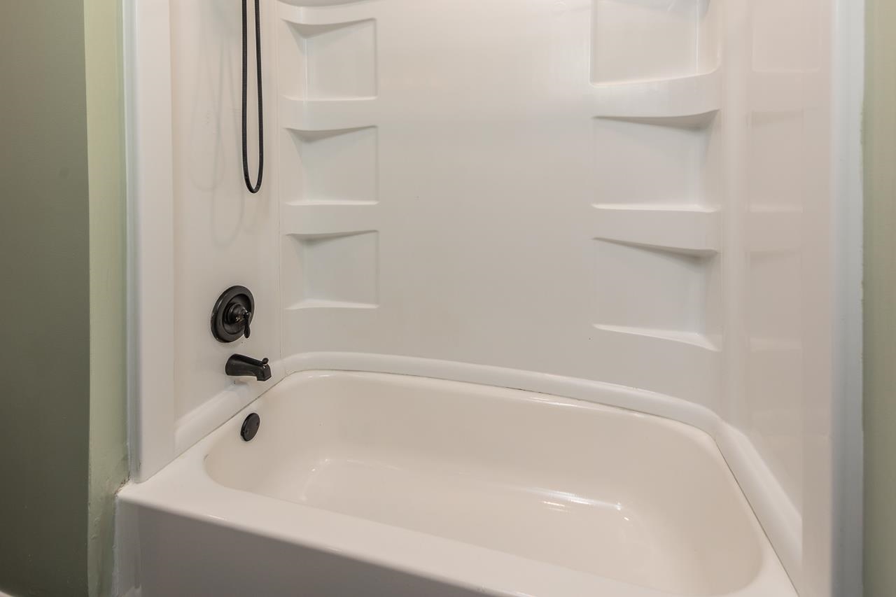 401 Green Acres Road Memphis, TN 38117 - Photo 18 of 34 a close up of a bathtub in a bathroom