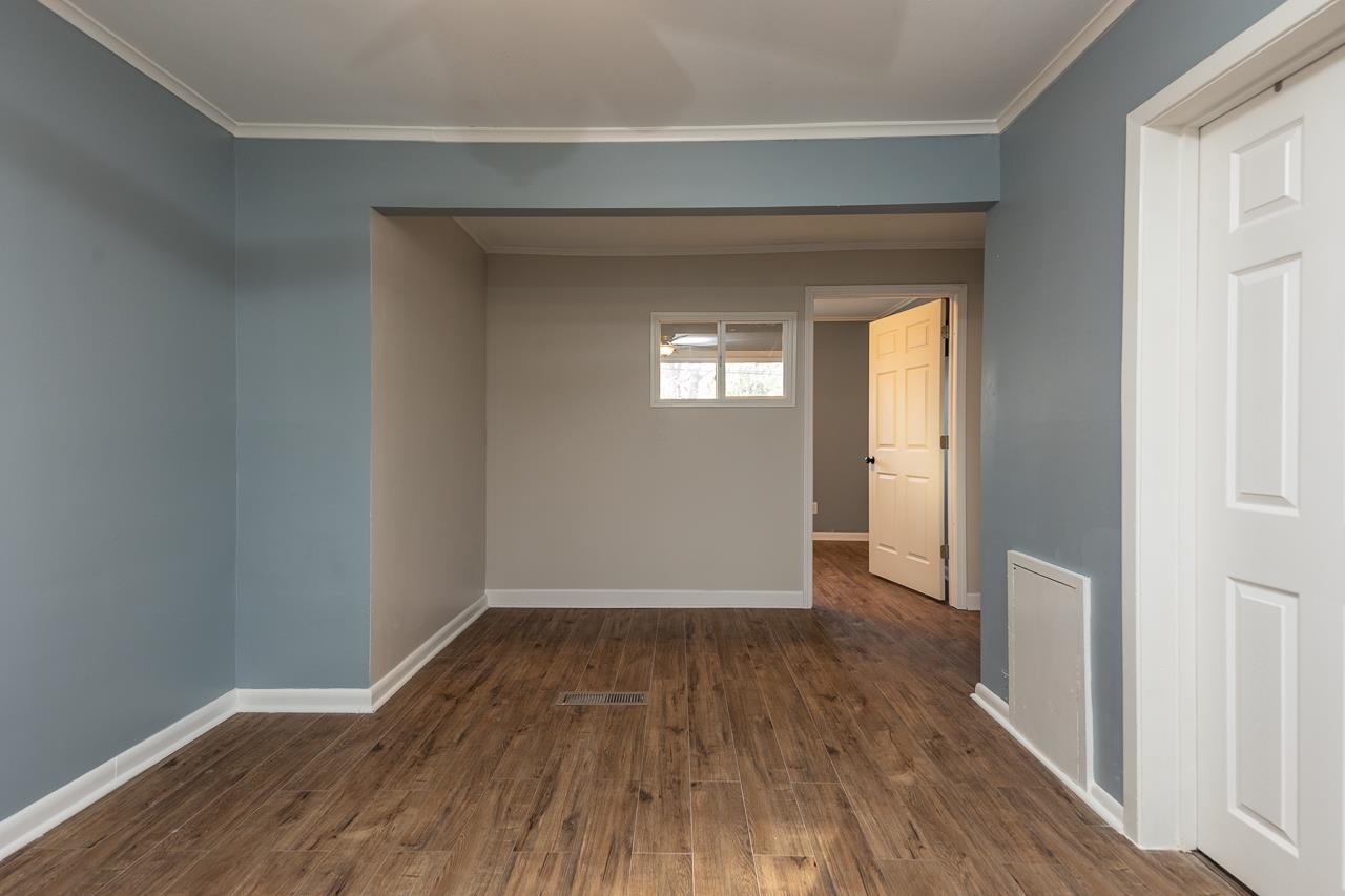 401 Green Acres Road Memphis, TN 38117 - Photo 23 of 34 a view of a room with wooden floor and a window