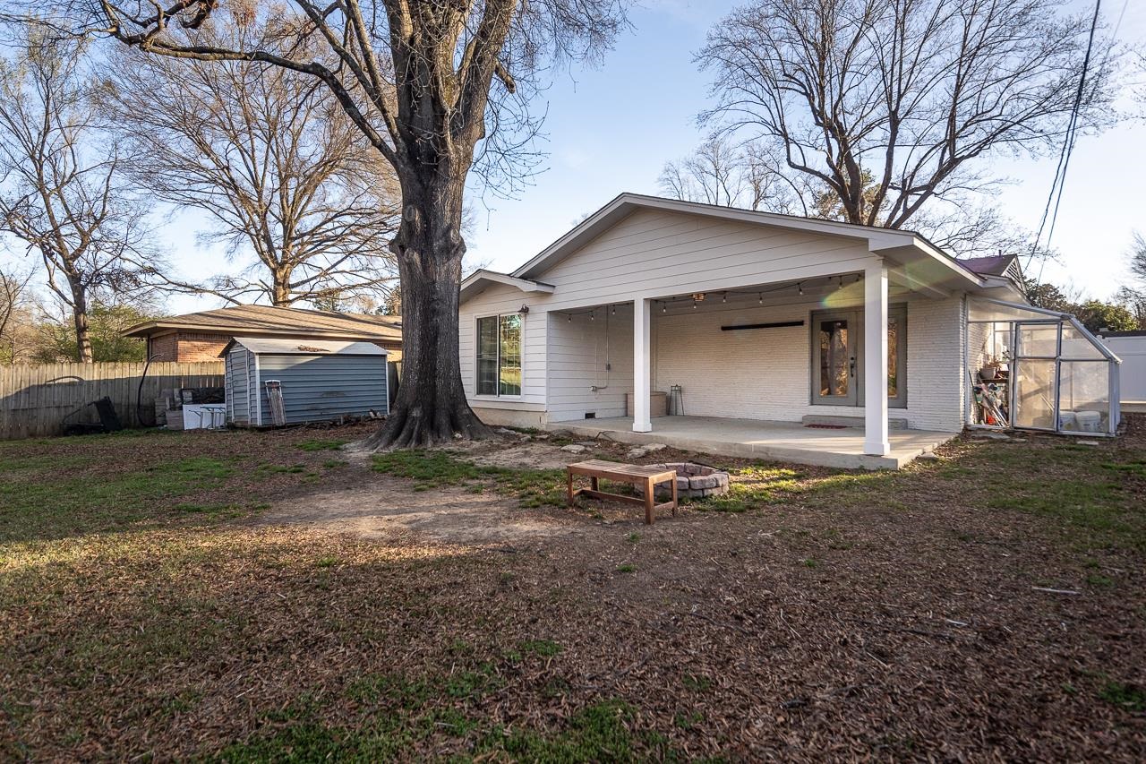 401 Green Acres Road Memphis, TN 38117 - Photo 32 of 34 a house with trees in front of it