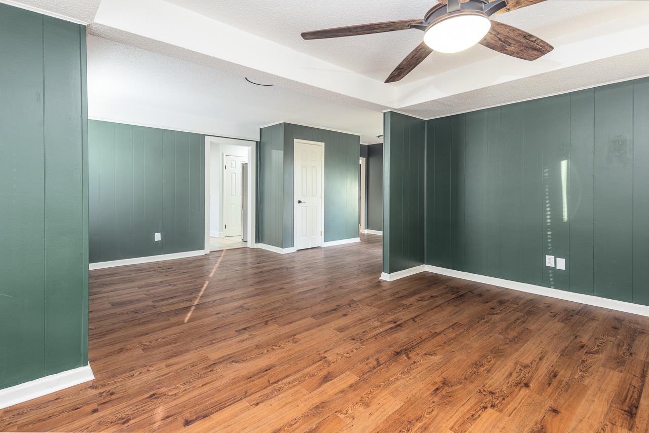 401 Green Acres Road Memphis, TN 38117 - Photo 10 of 34 a view of a room with wooden floor and fan in a room
