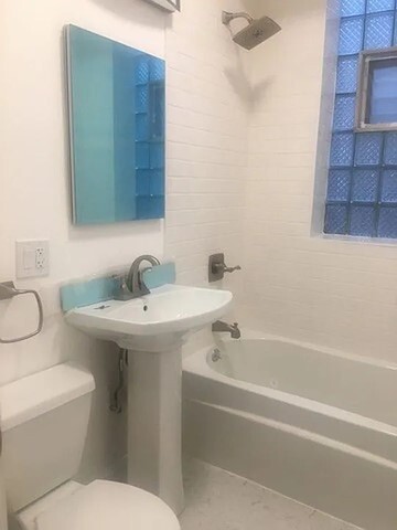 1524 North Ashland Avenue Chicago, IL 60622 - Photo 11 of 38 a bathroom with a sink and a toilet