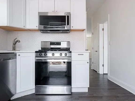 an empty room with wooden floor